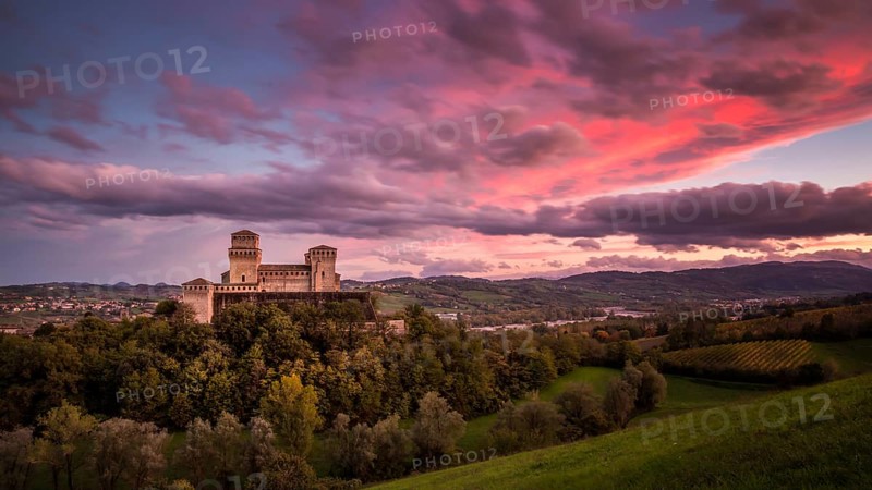 Torrechiara Castle or Castello di Torrechiara at dusk