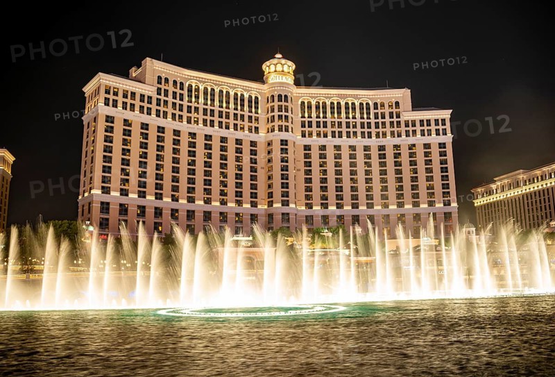 Illuminated fountain in front of the Bellagio Hotel at night