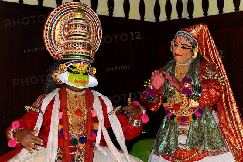 Fully made-up and costumed Kathakali dancers during a performance