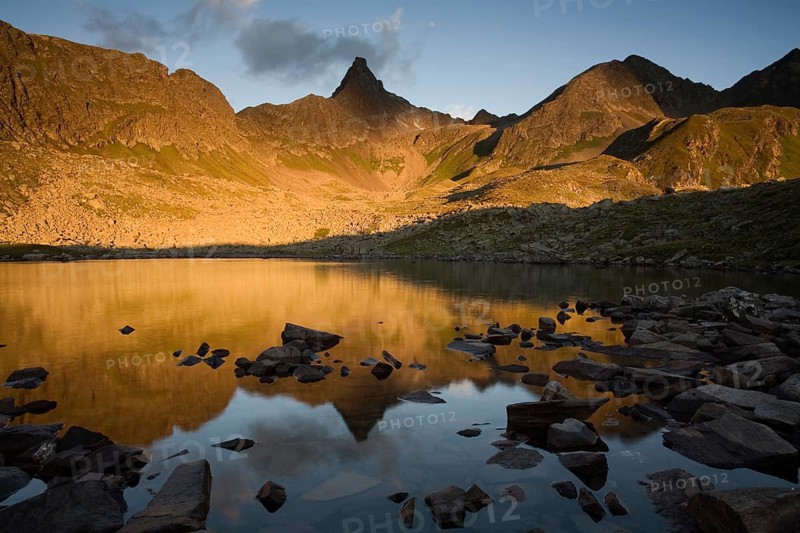 Mountain range reflected in a small lake