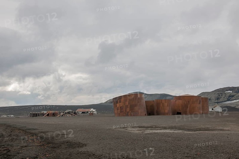 Dilapidated research station and old tanks for holding whale oil