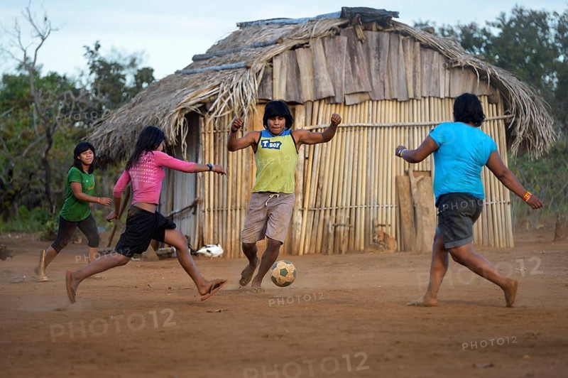 Youngers of the indigenous Xavante people playing football