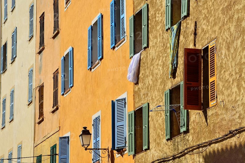 Row of houses with colourful shutters