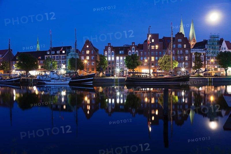 Trave river and the historic centre at full moon