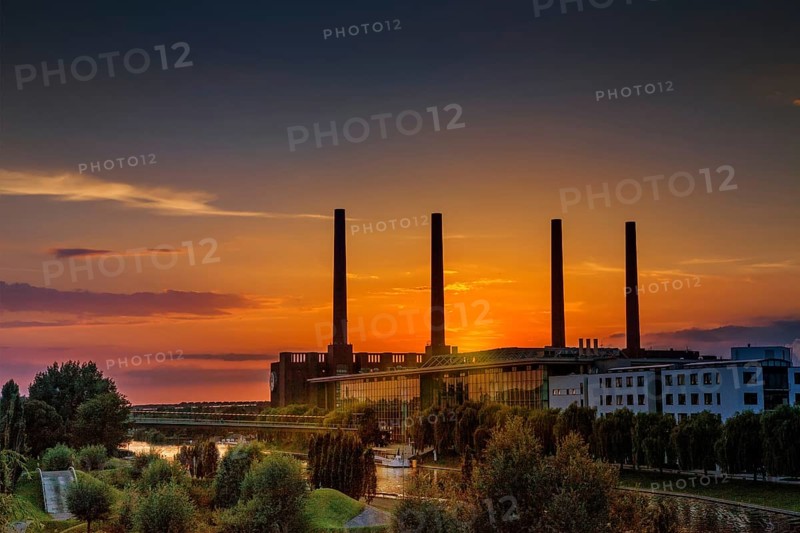 VW KonzernForum premises with the entrance to the Autostadt complex and the heating station of the Volkswagen plant with its four chimneys