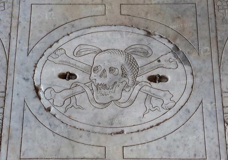 Marble slab with a skull relief