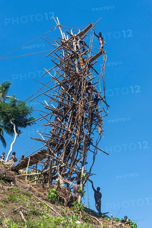 Man jumping from a bamboo tower