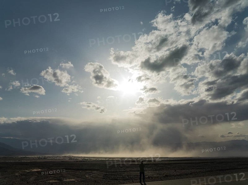 A sand storm over the Mesquite Flat Sand Dunes and the Panamint Range in the evening