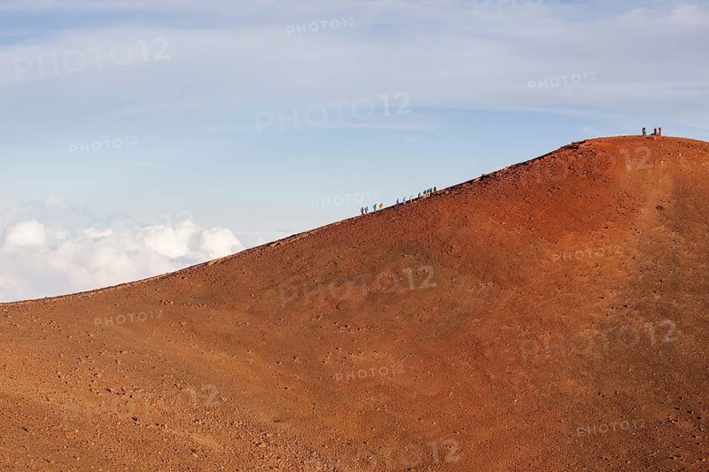 Hikers on the summit of the Mauna Kea volcano