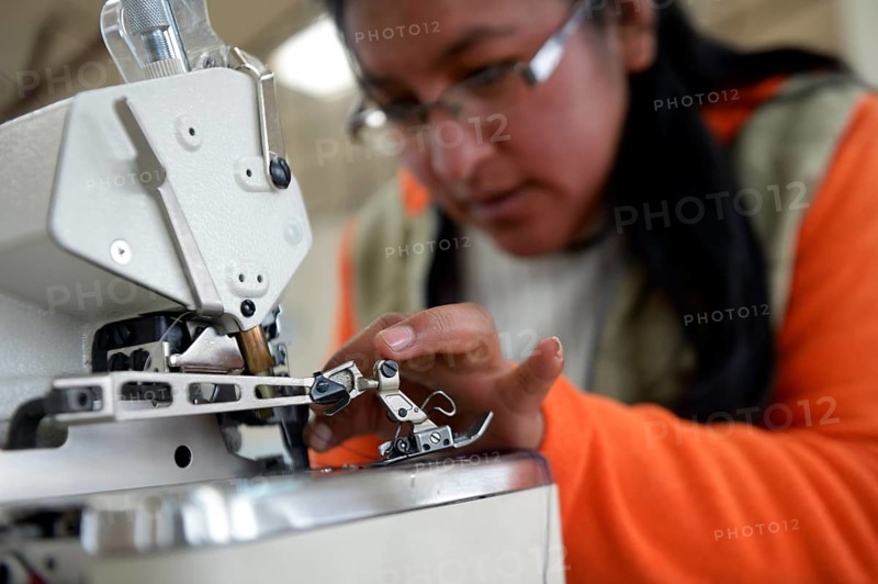 Seamstress working on a sewing machine