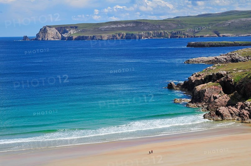 Sandy beach and rocks in Rispond Bay
