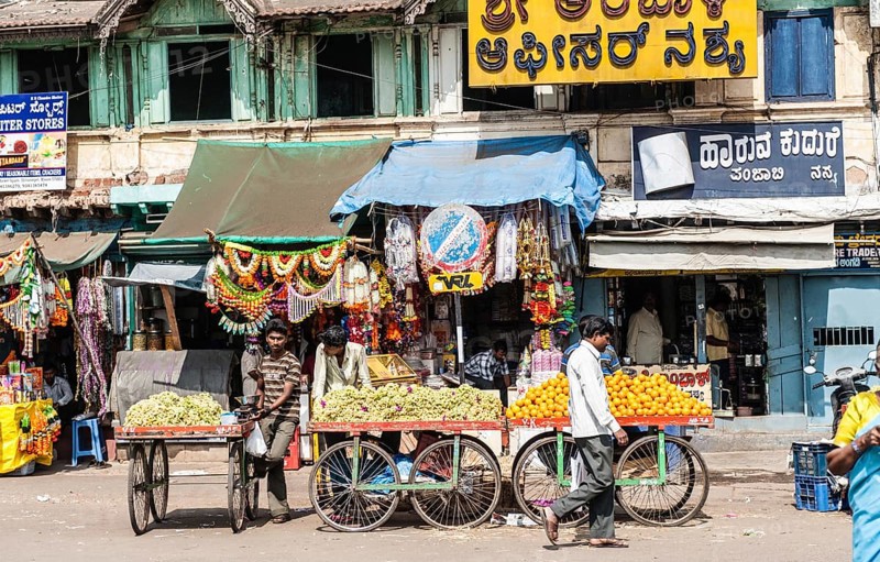 Stall with bananas and oranges