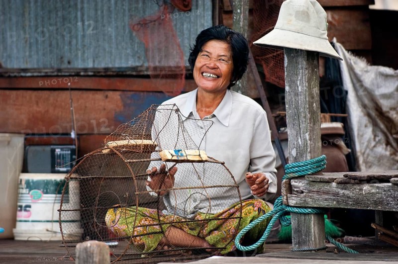 Native woman with a fish trap