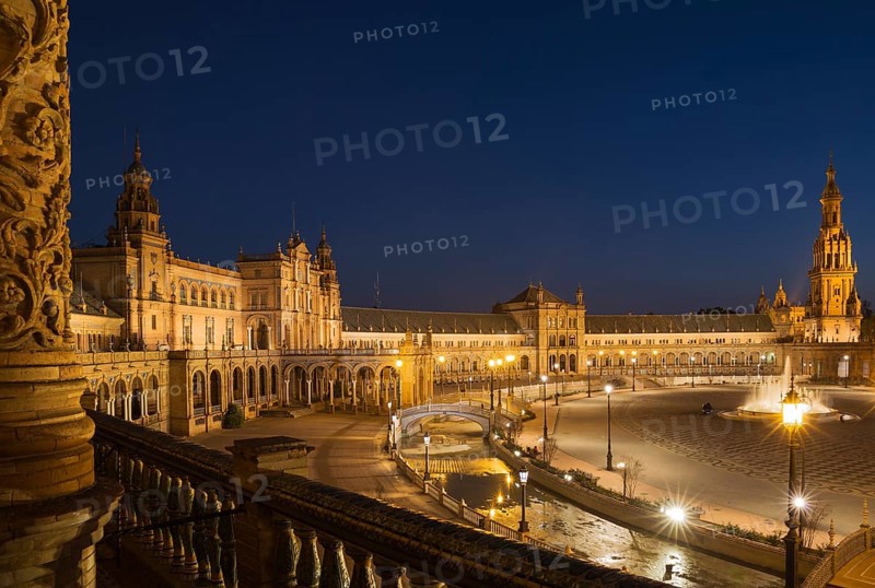 The illuminated Plaza de Espana at dusk