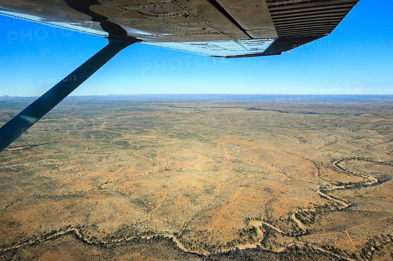 View from a small plane over the dry riverbed of Oanob River