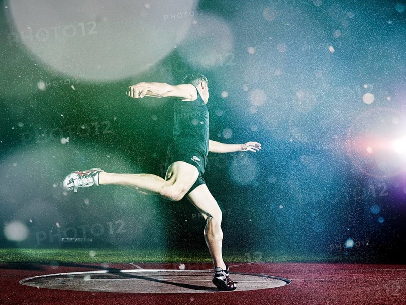Discus thrower spinning before a throw
