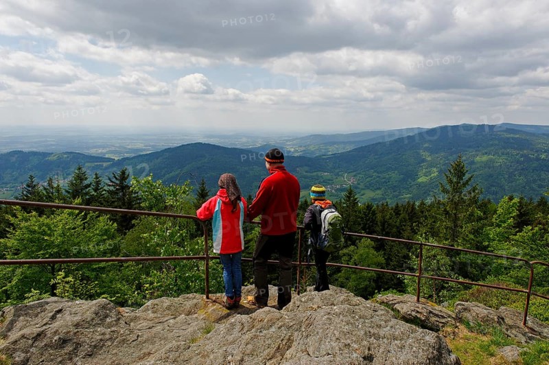 Hikers enjoying the view of the Danube plain from Kreuzfelsen peak