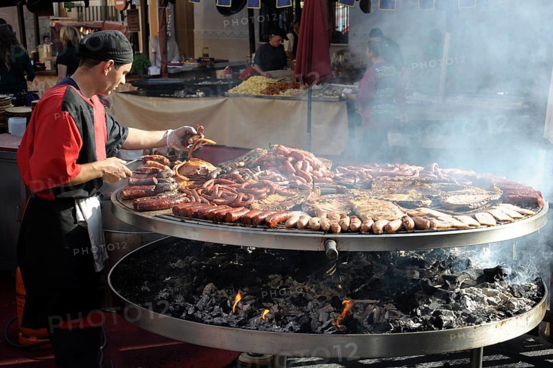 Cook handles giant barbecue at the annual All Saints Market in Cocentaina