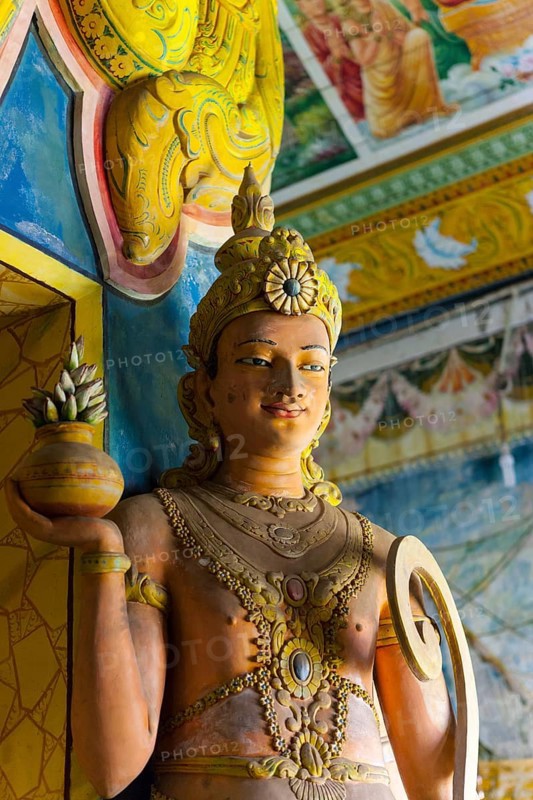 Statue in the old Buddhist temple complex of Sri Pushparama Maha Viharaya