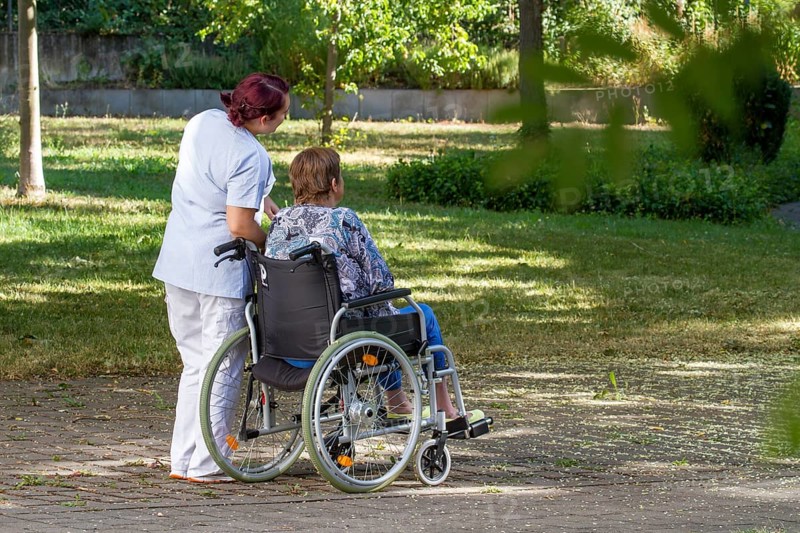 Woman sitting in wheelchair