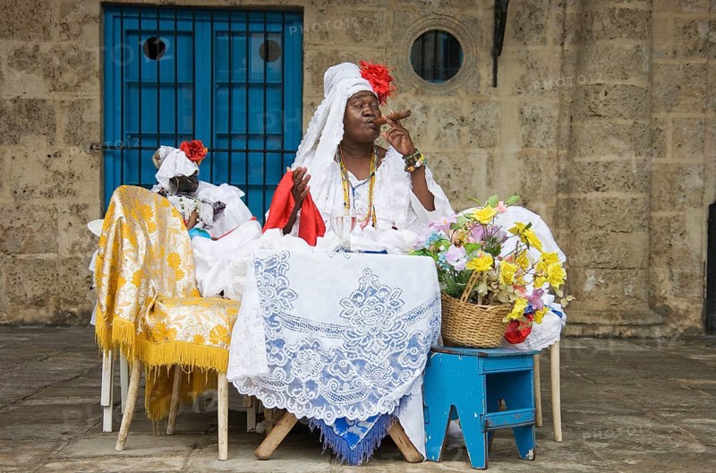 Fortune teller posing with a cigar
