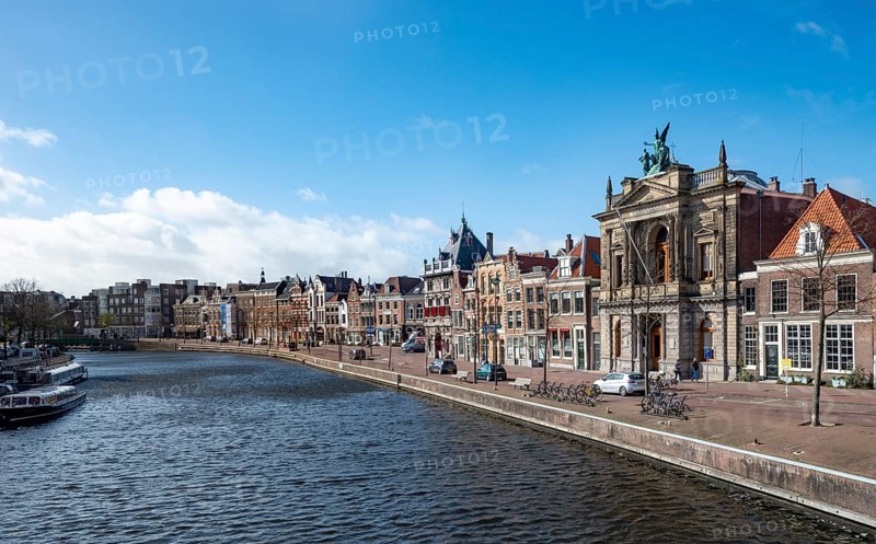 Gracht Spaarne with historic houses and Teylers Museum
