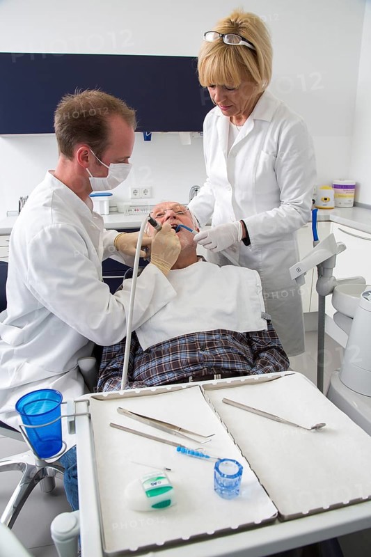 Senior man receiving treatment at the dentist
