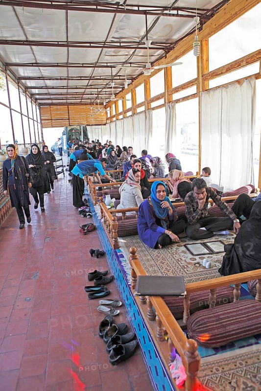 Young Iranians having lunch in a traditional restaurant