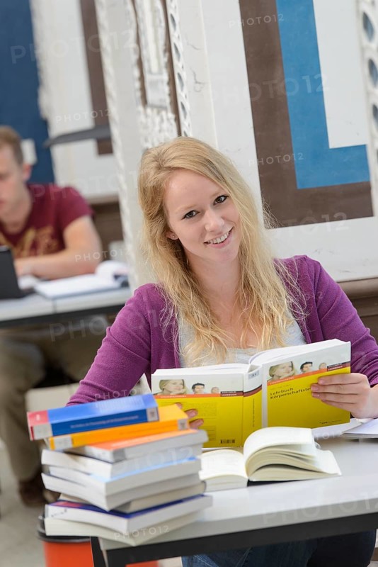 Student studying in the departmental library of the University of Hohenheim in Schloss Hohenheim Palace