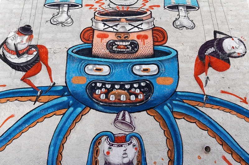 Surreal mural with heads nested into each other