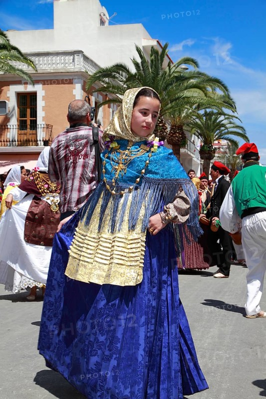 Young woman in traditional costume performing typical dance