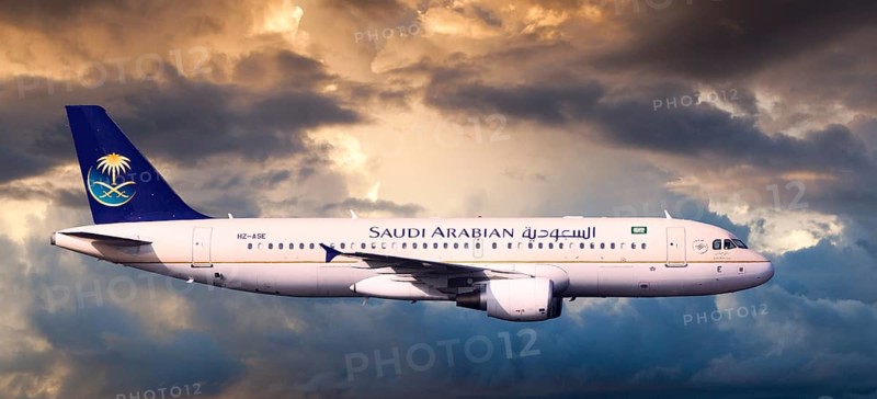 Saudi Arabian Airlines Airbus A320-214 in flight in the evening light