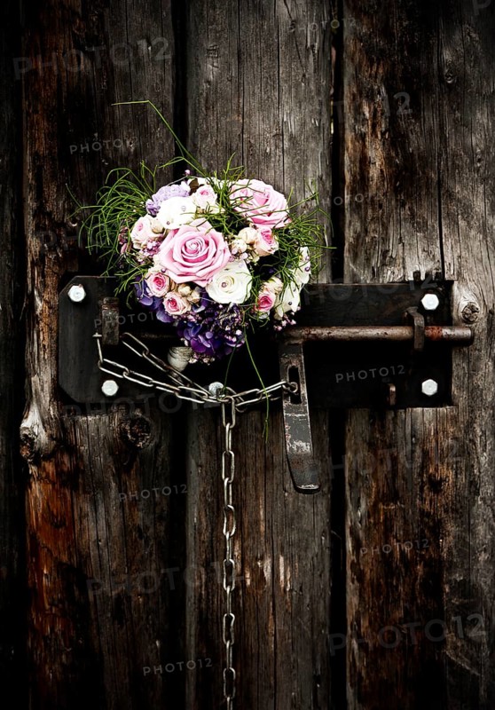 Bridal bouquet in an old door lock