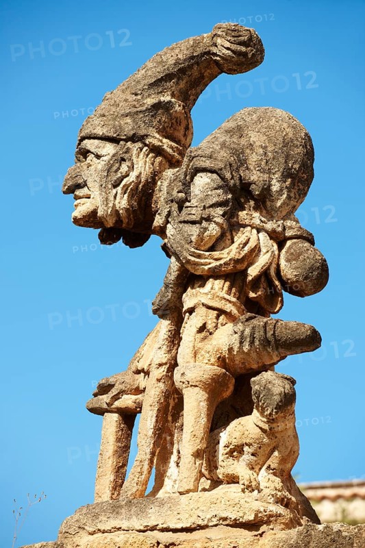 Baroque statue on the wall of Villa Palagonia