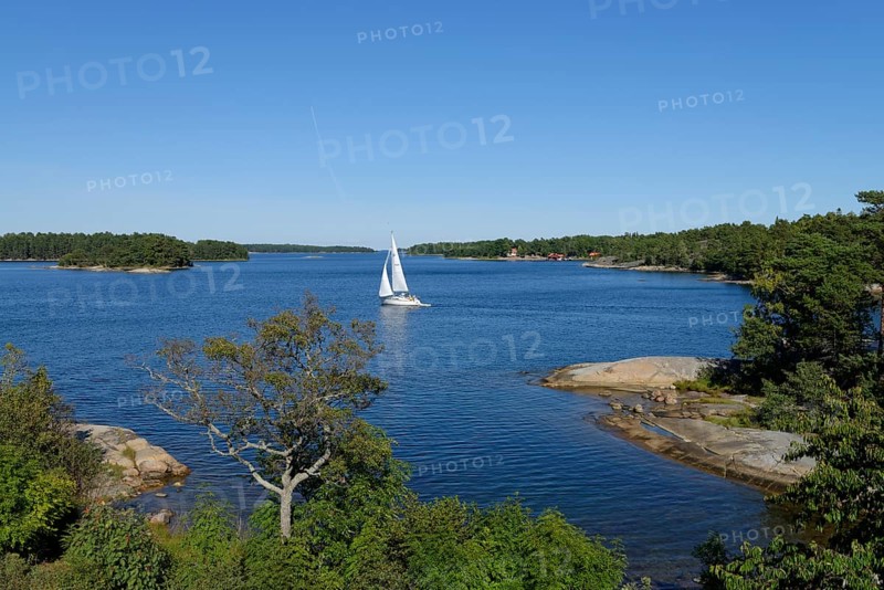 Sailboat and typical round polished rocks