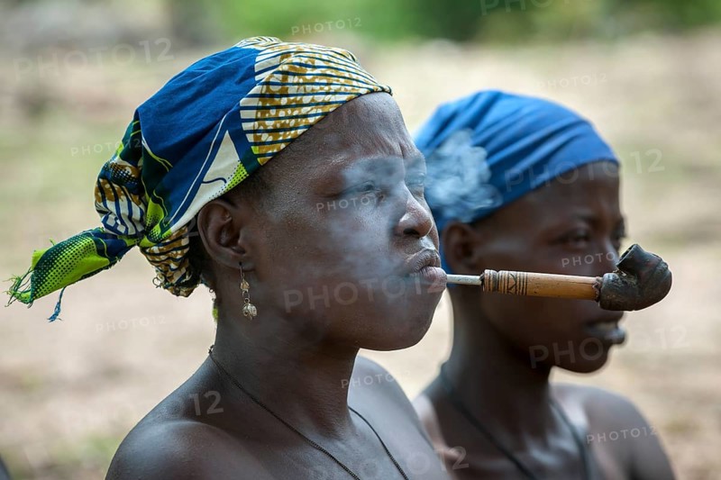 A woman from the Koma people smoking a pipe