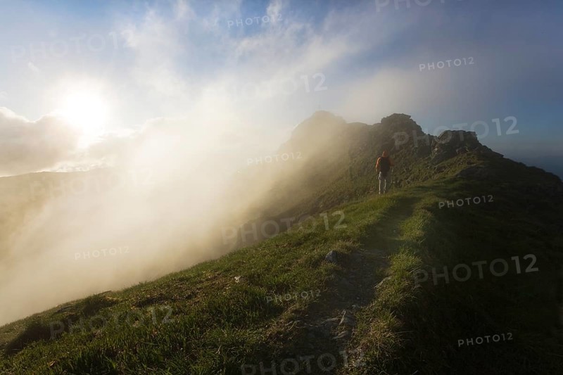 Hiker on the summit of Mt Grosser Galtenberg in the evening light