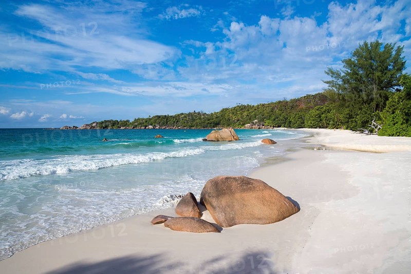 Sandy beach with the typical rock formations of the Seychelles