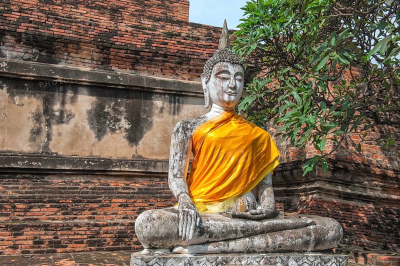 Buddha statue next to the central stupa
