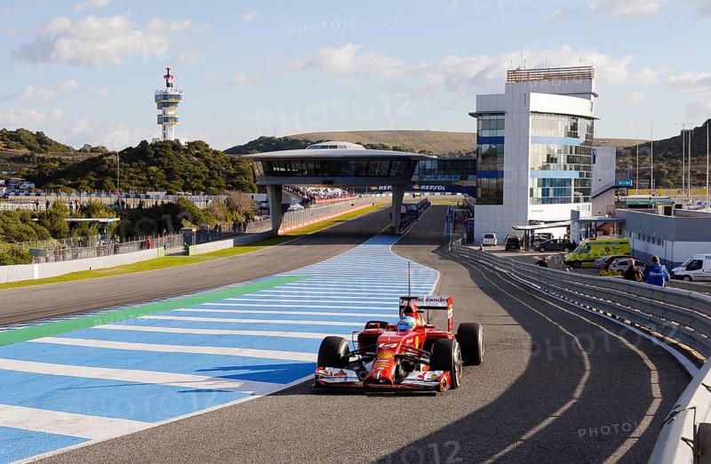 Fernando Alonso in the Ferrari F14 T in the pit lane exit