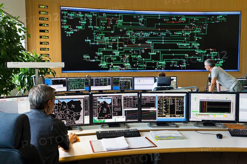 Shift supervisor Hans-Peter Polzer sitting at his work station in the Transmission Control Center