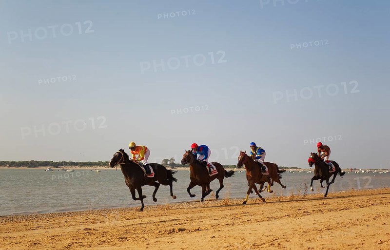Horse race at the beach of Sanlucar de Barrameda at the Guadalquivir river mouth