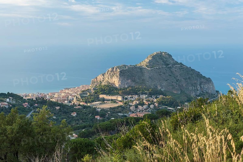Limestone rock Rocca di Cefalu with the town of Cefalu
