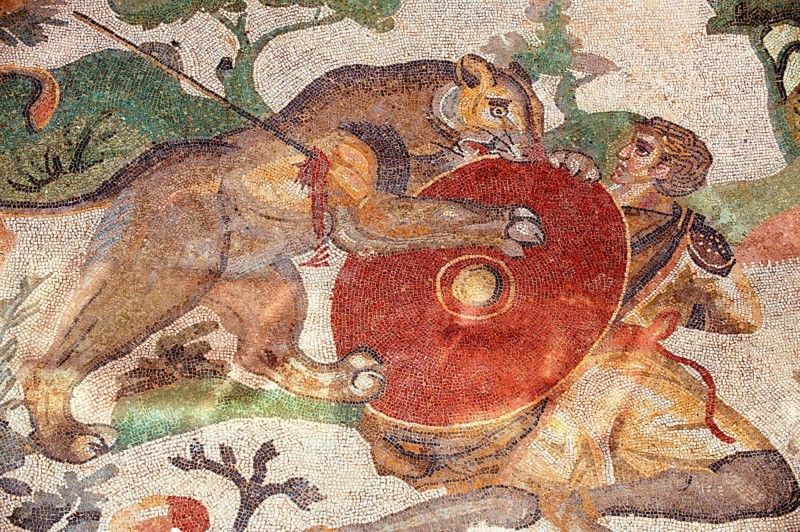 Ancient Roman mosaic of a hunter and a lion