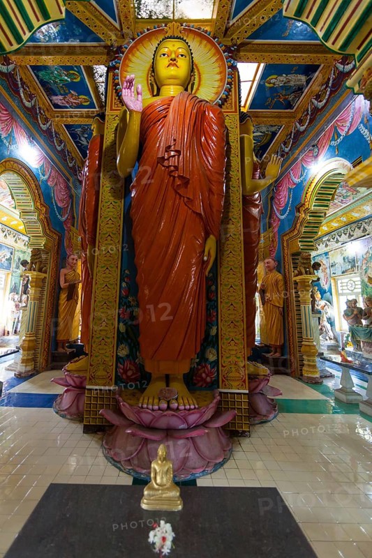 Statue in the old Buddhist temple complex of Sri Pushparama Maha Viharaya