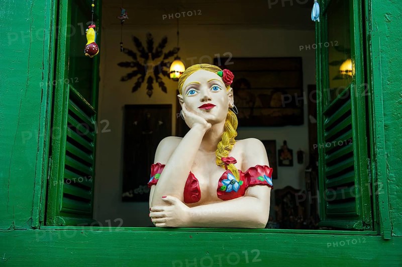 Traditional puppet in a window
