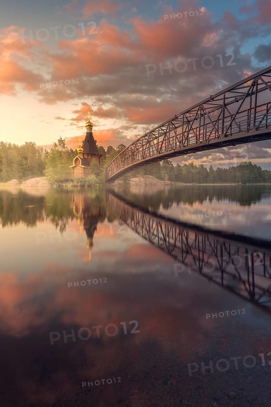 Bridge and Church of St. Andrew at Vuoksi River during sunset