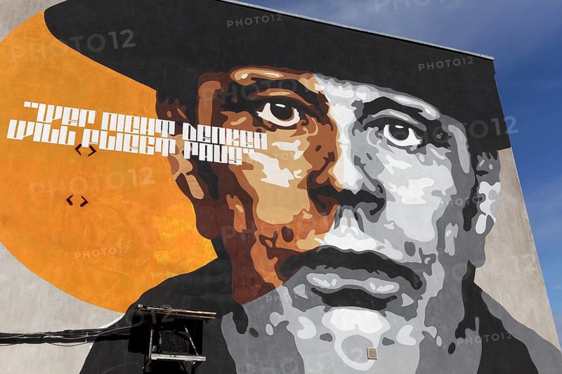 Portrait of the artist Joseph Beuys on a house wall