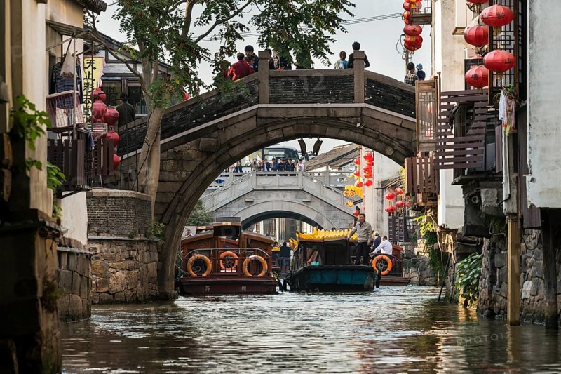 Bridge over a waterway with boats