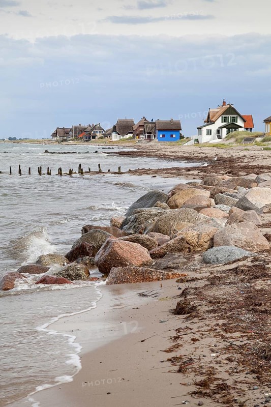 Cottages with thatched roofs on the coast